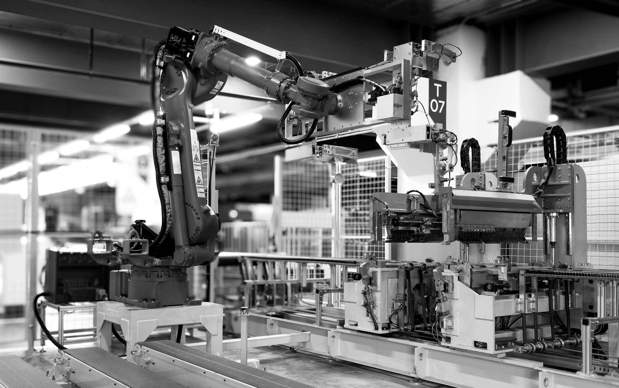 Industrial robot arm working on a factory production line